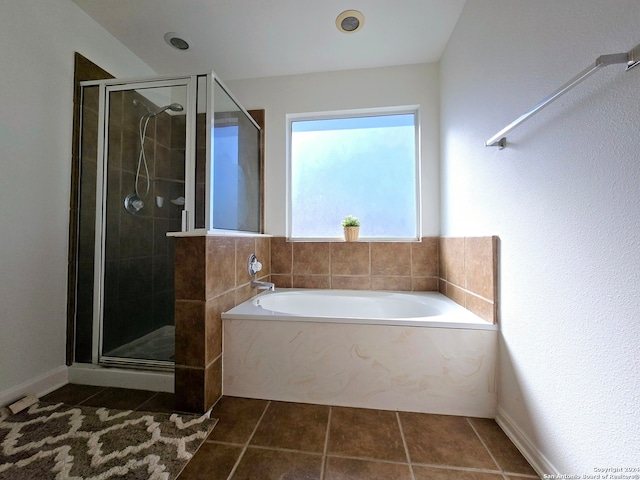 bathroom with tile patterned flooring and independent shower and bath