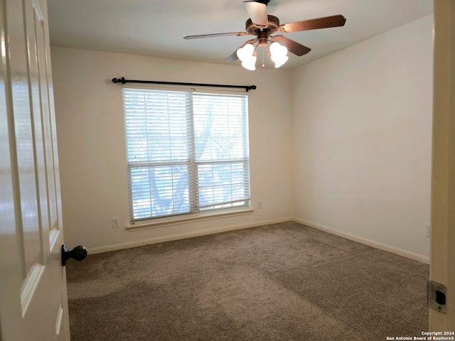 unfurnished room with ceiling fan and carpet floors