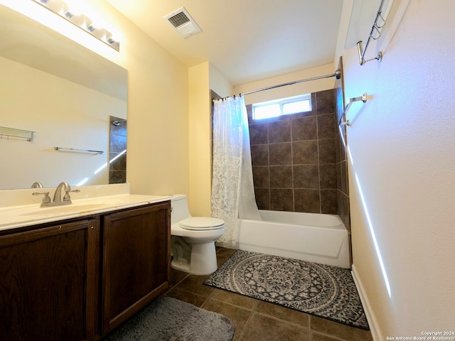 full bathroom with tile patterned floors, shower / tub combo with curtain, vanity, and toilet