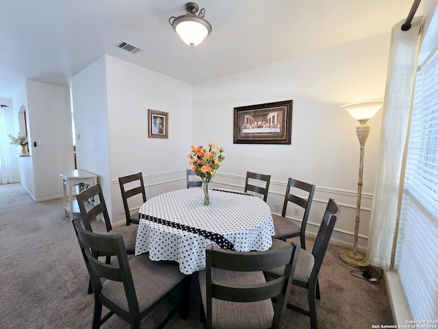 view of carpeted dining area