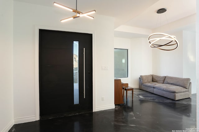 entryway featuring a notable chandelier