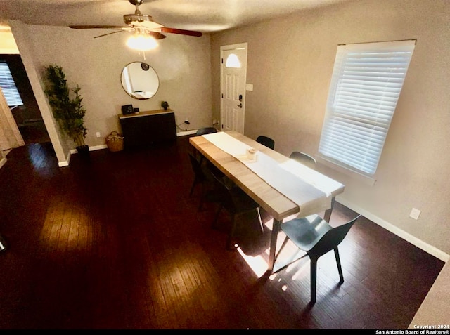 unfurnished dining area featuring ceiling fan and hardwood / wood-style flooring