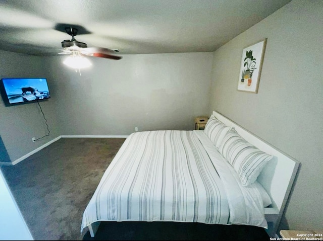 bedroom featuring dark colored carpet and ceiling fan