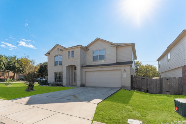 view of front property with a front yard and a garage