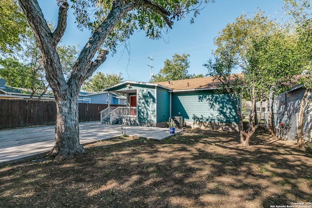 rear view of property featuring a patio