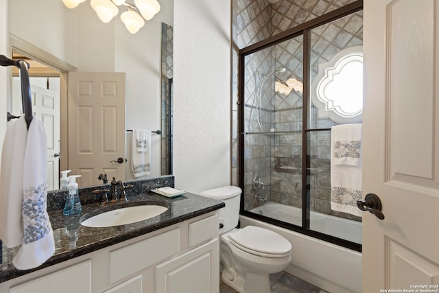 full bathroom featuring vanity, toilet, and enclosed tub / shower combo