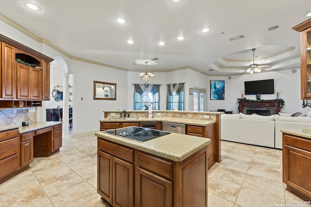 kitchen featuring black electric cooktop, crown molding, a center island, and stainless steel dishwasher