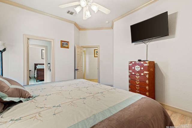 bedroom with hardwood / wood-style flooring, ceiling fan, and crown molding