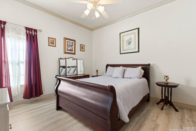 bedroom with light hardwood / wood-style flooring, ceiling fan, and crown molding