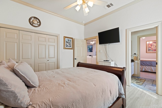 bedroom with connected bathroom, ceiling fan, ornamental molding, a closet, and light wood-type flooring