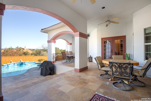 view of patio with ceiling fan, a fenced in pool, and french doors