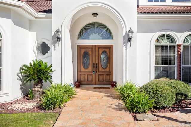 26006 Syrinx, San Antonio, TX 78260 - view of exterior entry featuring stucco siding and a tiled roof