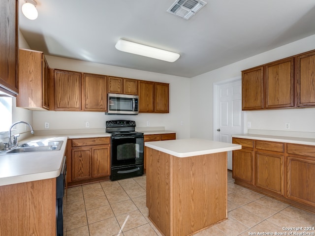 kitchen featuring a kitchen island, light tile patterned floors, sink, and black range with electric cooktop