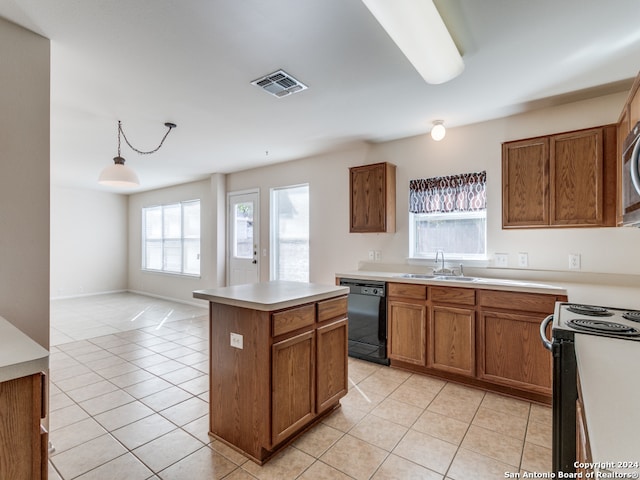 kitchen with electric range, light tile patterned floors, black dishwasher, pendant lighting, and a kitchen island