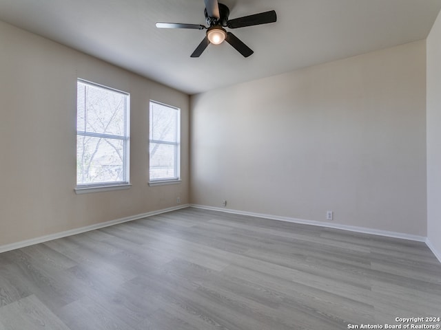 spare room with ceiling fan and light hardwood / wood-style flooring