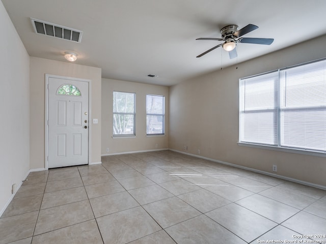 tiled foyer entrance featuring ceiling fan