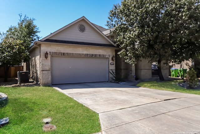 single story home featuring central air condition unit and a front yard