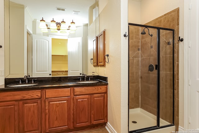 bathroom with vanity and a shower with door