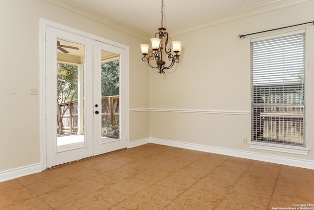 interior space with ceiling fan with notable chandelier, ornamental molding, and french doors