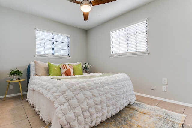 bedroom with tile patterned flooring and ceiling fan