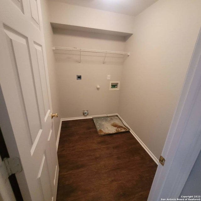 laundry room featuring washer hookup, dark hardwood / wood-style flooring, gas dryer hookup, and electric dryer hookup