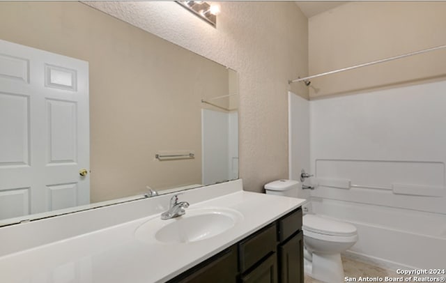 full bathroom with shower / bathing tub combination, vanity, and toilet