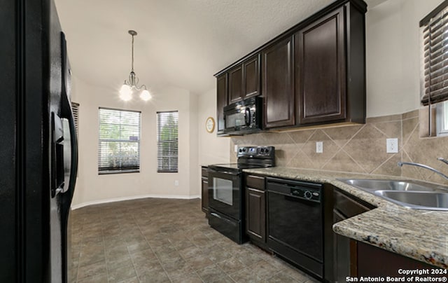 kitchen featuring sink, a notable chandelier, lofted ceiling, dark brown cabinets, and black appliances