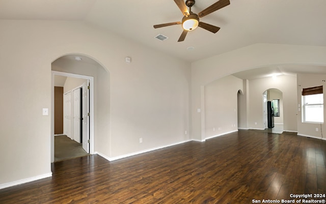 unfurnished living room featuring vaulted ceiling, ceiling fan, and dark hardwood / wood-style floors