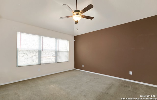 carpeted empty room with ceiling fan