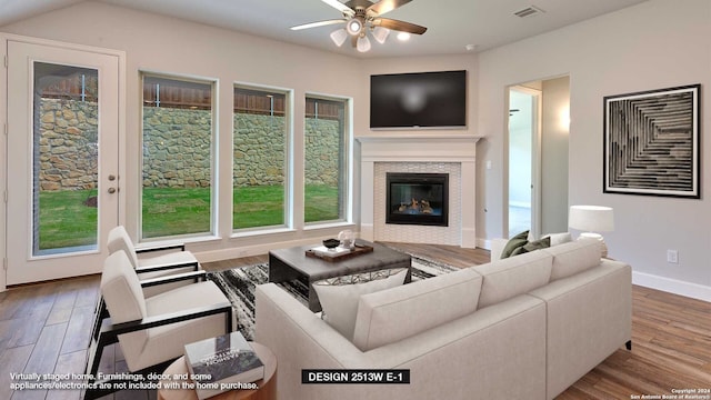 living room with hardwood / wood-style flooring and ceiling fan