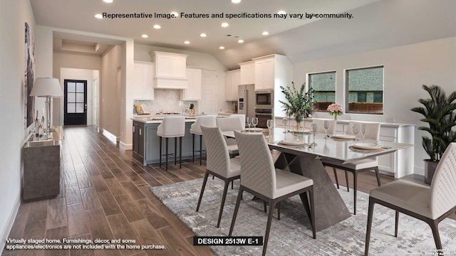 dining room with dark hardwood / wood-style floors and vaulted ceiling