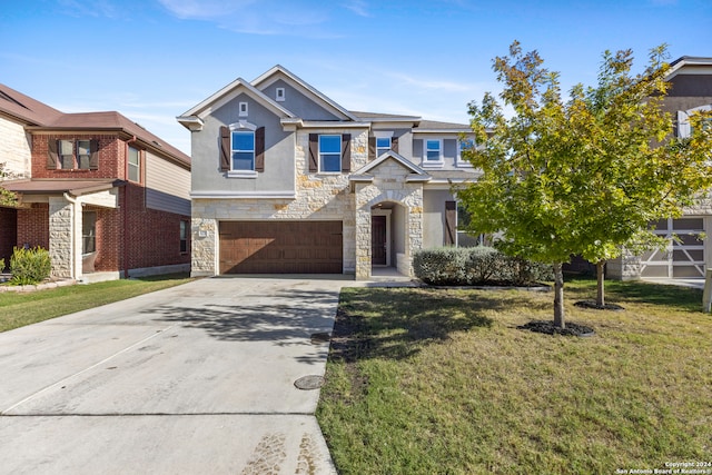 view of front of property featuring a garage and a front yard