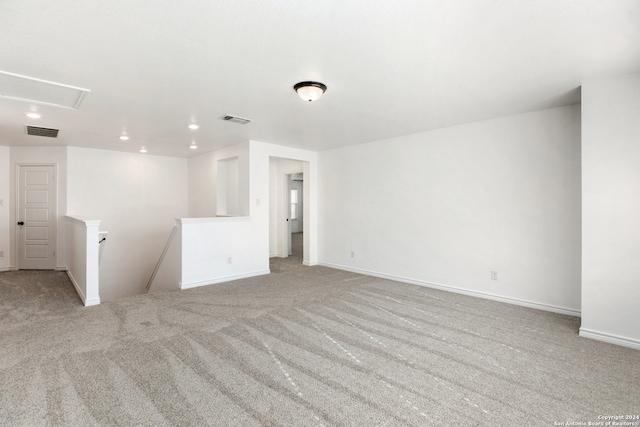 empty room with light colored carpet