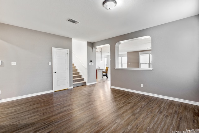 empty room featuring dark wood-type flooring