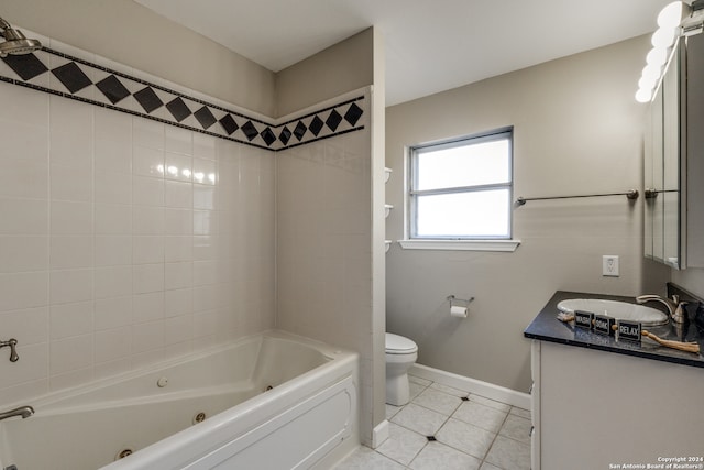 full bathroom featuring tile patterned flooring, vanity, toilet, and tiled shower / bath