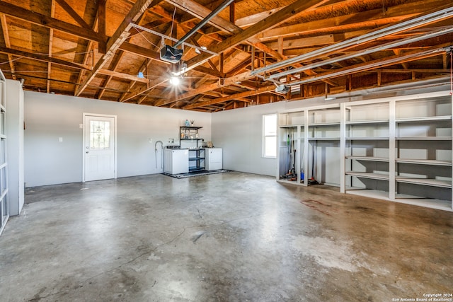 garage featuring a garage door opener and washer and clothes dryer