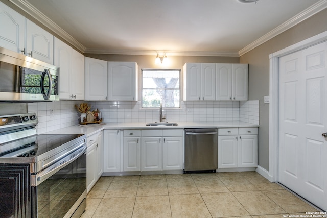 kitchen featuring light tile patterned floors, stainless steel appliances, and white cabinetry