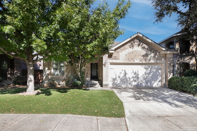 view of front facade with a garage and a front yard