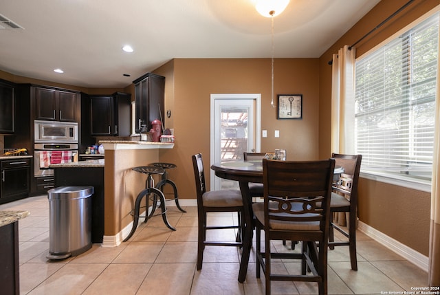 view of tiled dining space