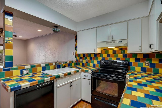 kitchen with a textured ceiling, sink, white cabinetry, and black appliances