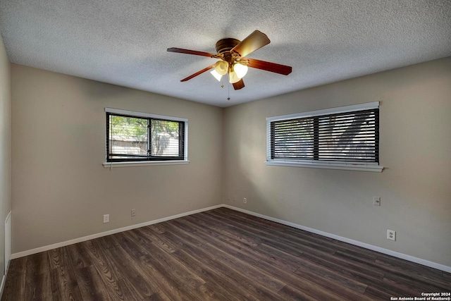 unfurnished room featuring a textured ceiling, ceiling fan, and dark wood-type flooring