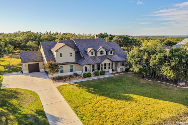 view of front of home featuring a garage and a front yard