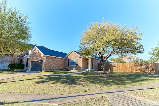 view of front facade featuring a front yard and a garage