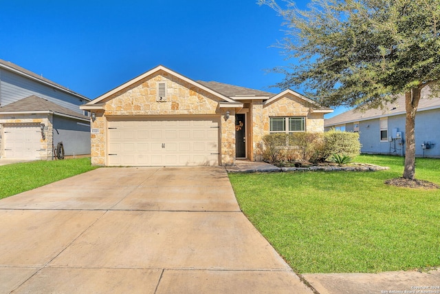 single story home featuring a garage and a front yard