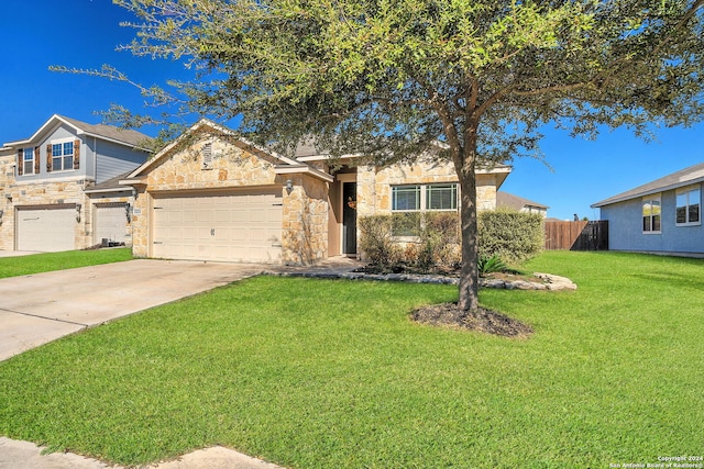 view of front of house with a garage and a front yard