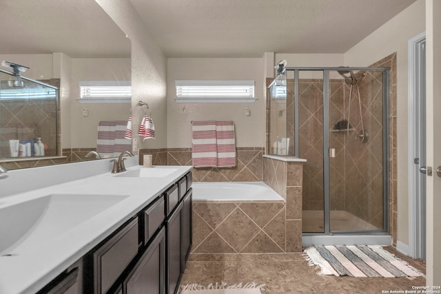 bathroom featuring radiator heating unit, vanity, and independent shower and bath