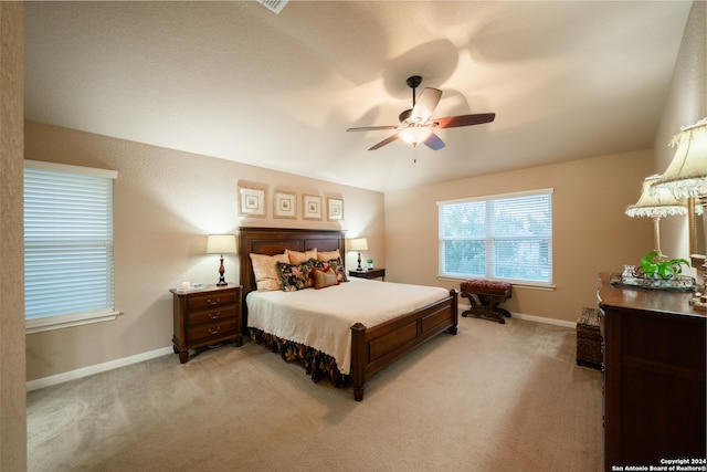 carpeted bedroom with ceiling fan and lofted ceiling