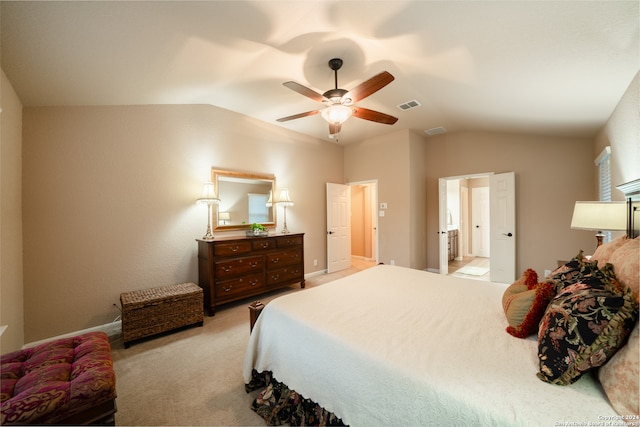 carpeted bedroom with ceiling fan and vaulted ceiling