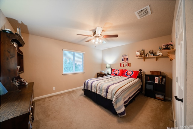 bedroom featuring ceiling fan and light colored carpet