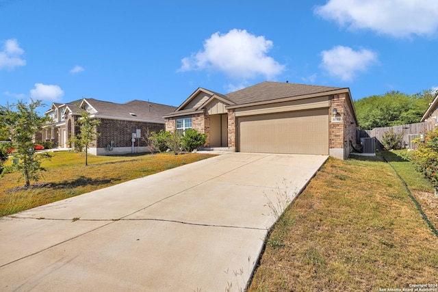 single story home featuring a front yard and a garage